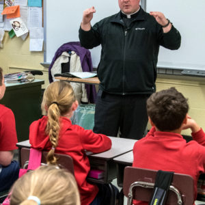 Fr. Matt Alcombright teaching at St. Michael’s